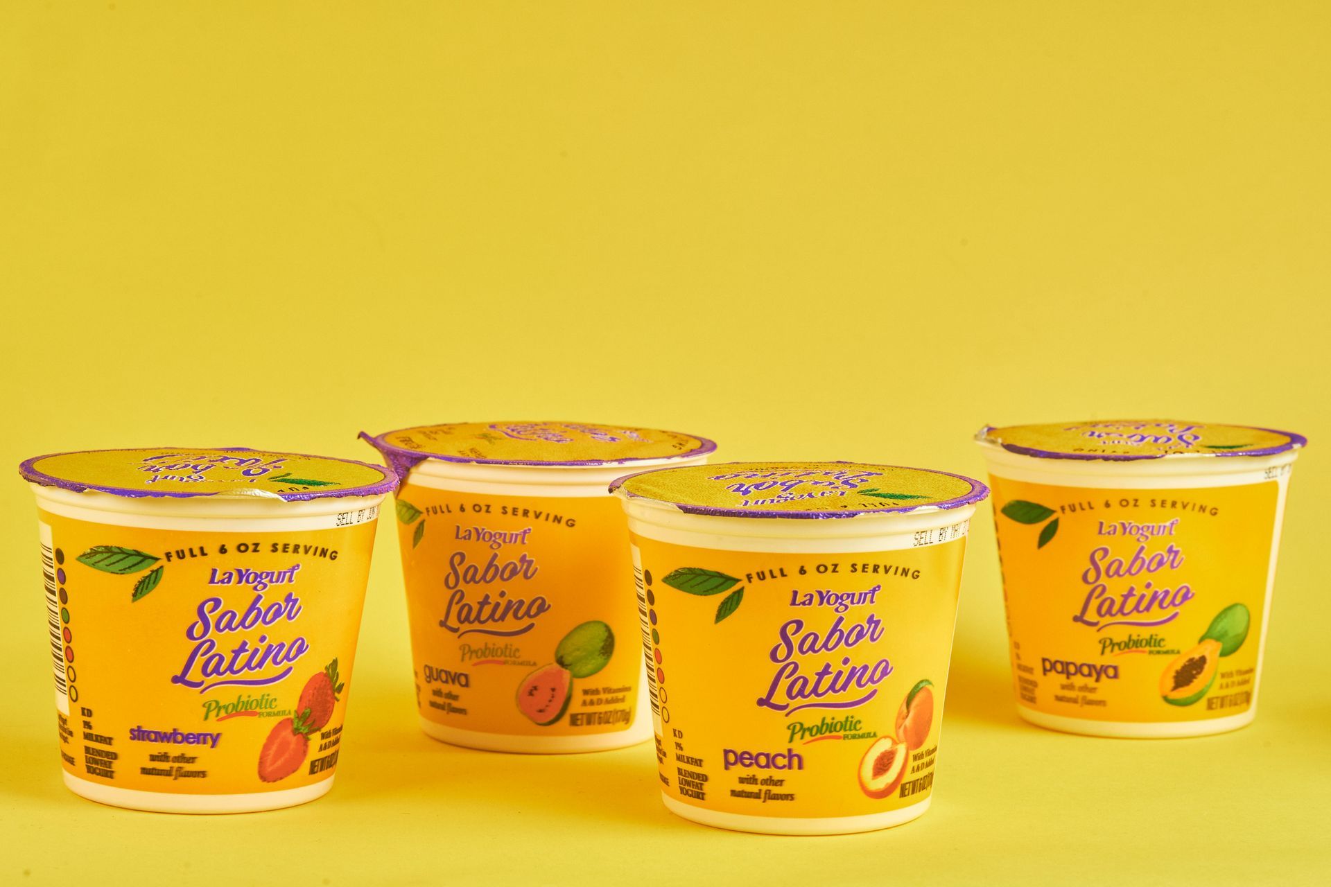 Table of Thai food: noodles, rice, shrimp, drinks, and desserts.