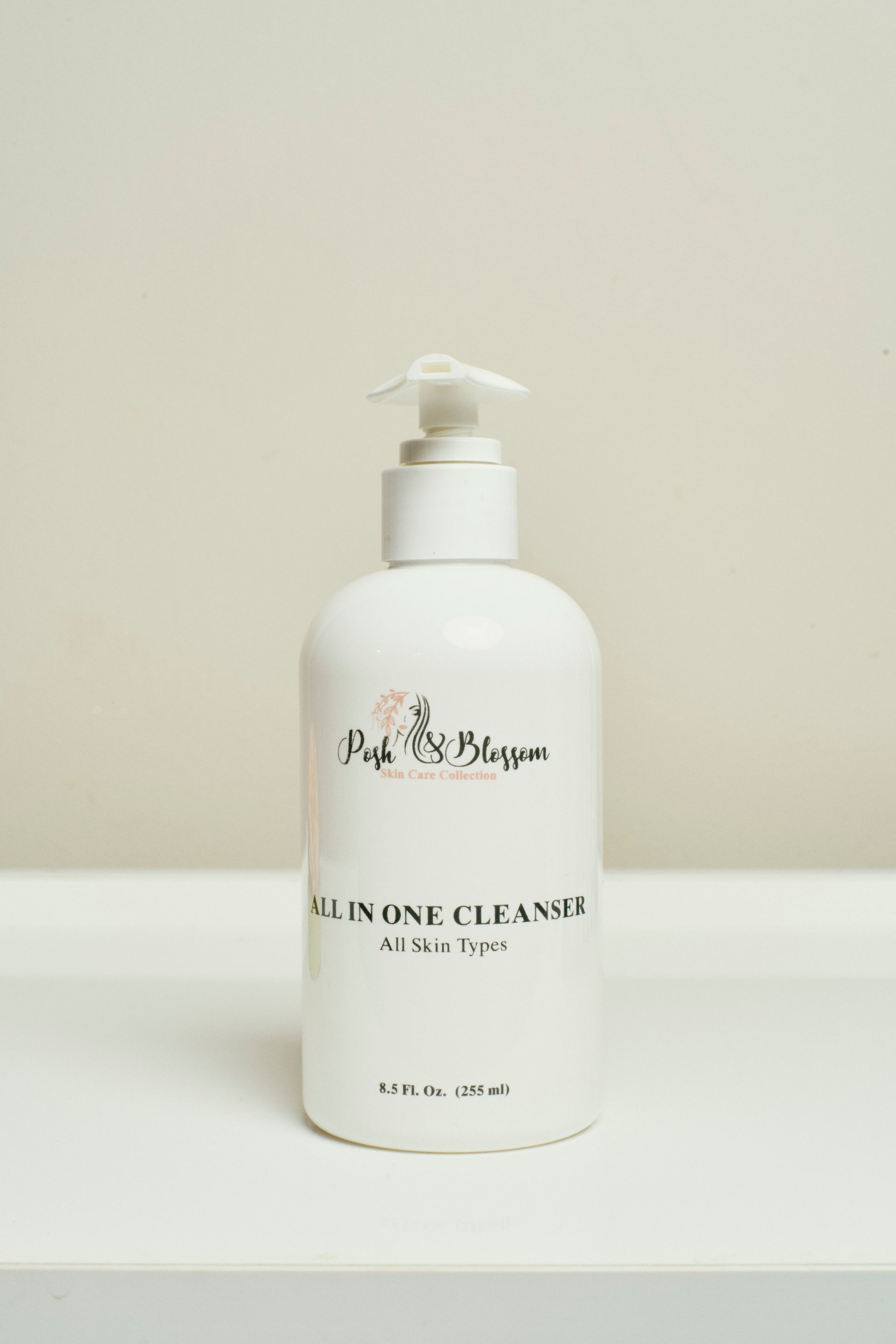 White bottle of cleanser with pump, 
