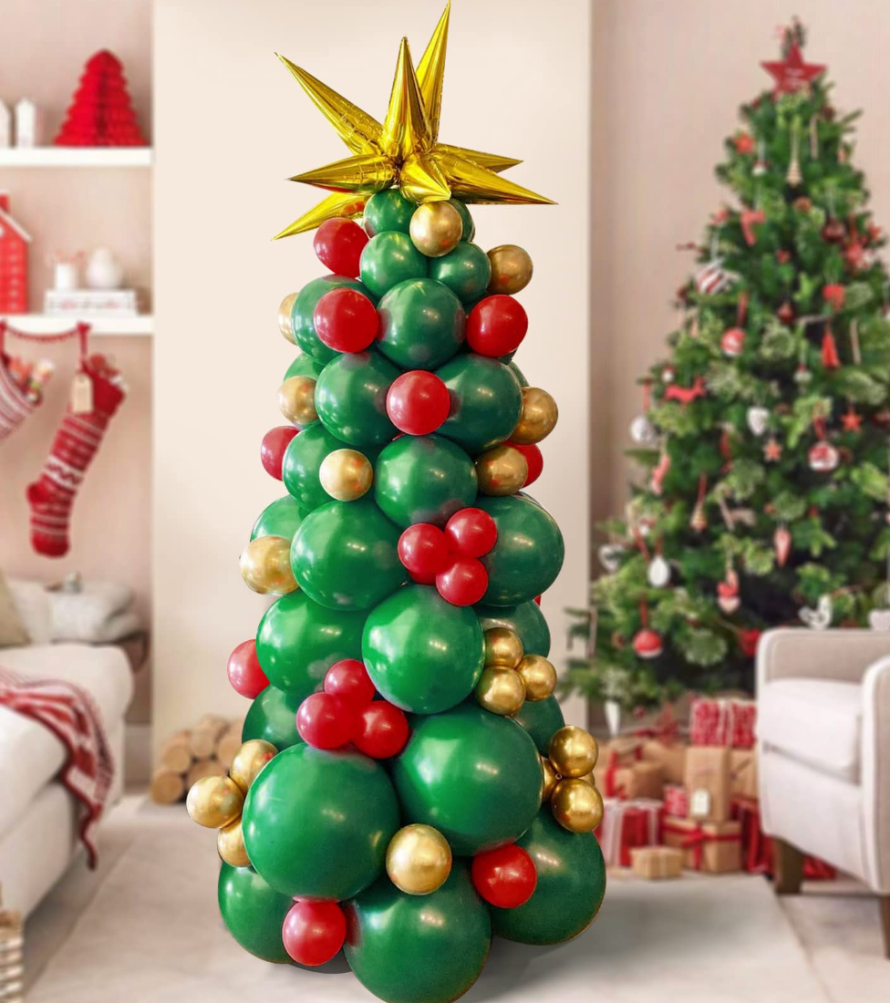 A christmas tree made out of balloons in a living room