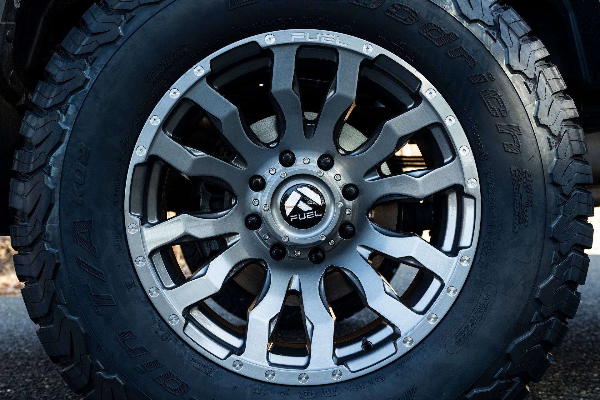 Fuel wheel with gray spokes and black tire.