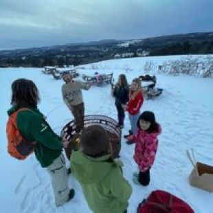 Group of children and adults outside in the winter