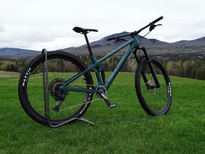 Transition Spur mountain bike in field in front of Burke Mountain, Vermont.