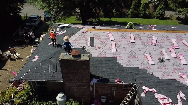 an aerial view of a roof being installed on a house Birds Eye Roofing Group.