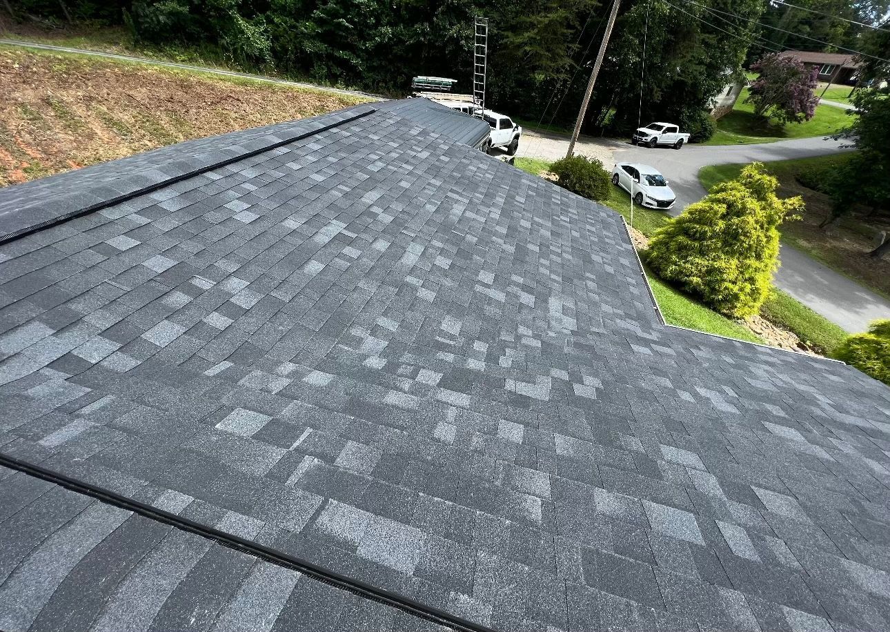 a close up of a roof with a lot of shingles on it Birds Eye Roofing Group.