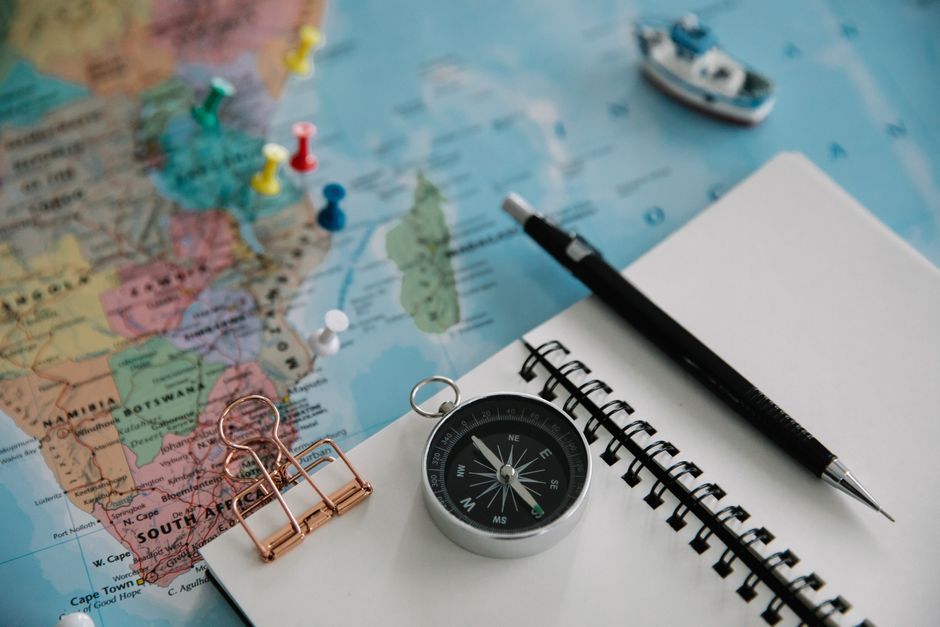 Minimalist map pin and compass still life representing location page SEO strategy