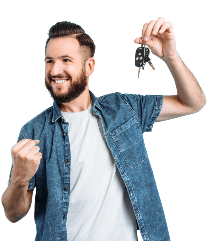 A man in a denim shirt is holding a pair of car keys.