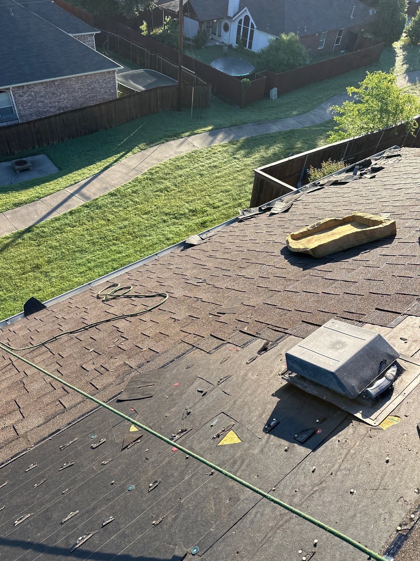 An aerial view of a roof with a yellow tray on it.
