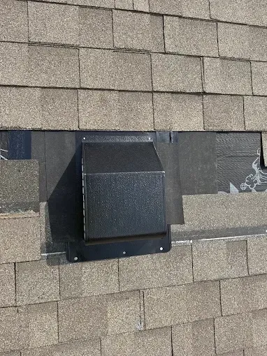 A black box is sitting on top of a roof.
