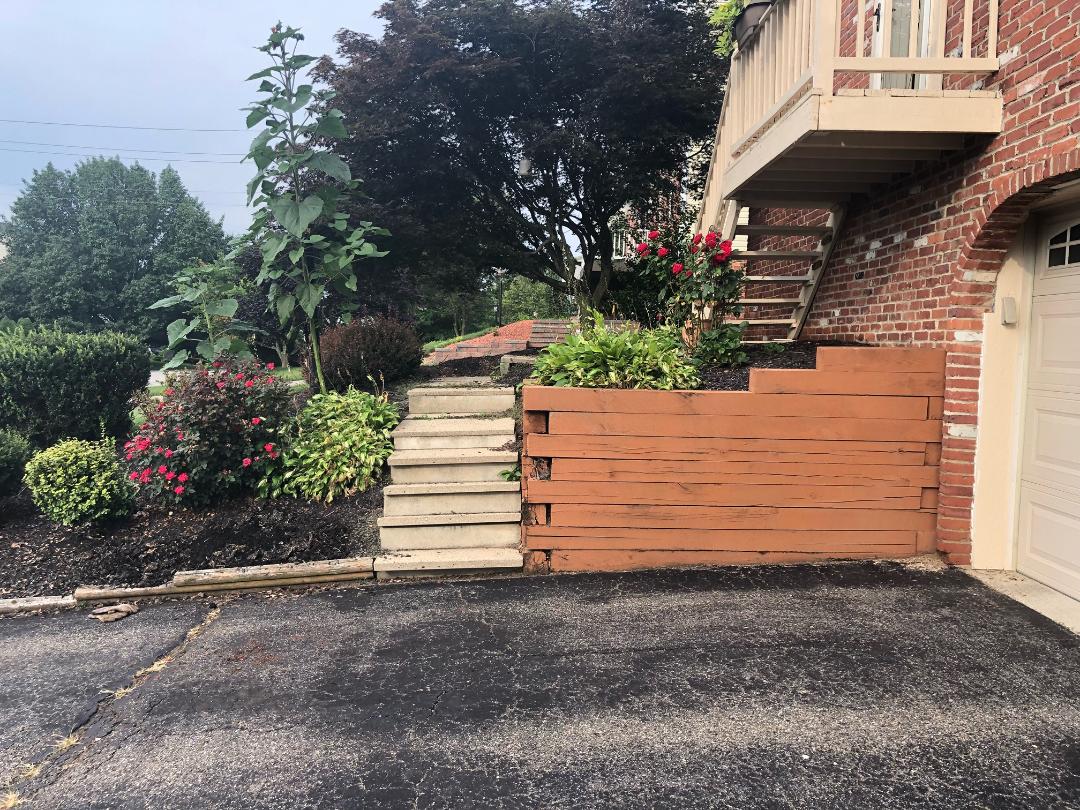 Before Picture of Wooden Retaining Wall