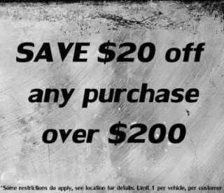 A sign that says save $20 off any purchase over $ 200