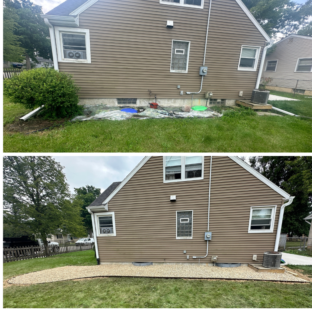 Landscaping install in Greater Lansing, MI. Services included: regrading, window well install, edging install, downspout drain, and stone install.