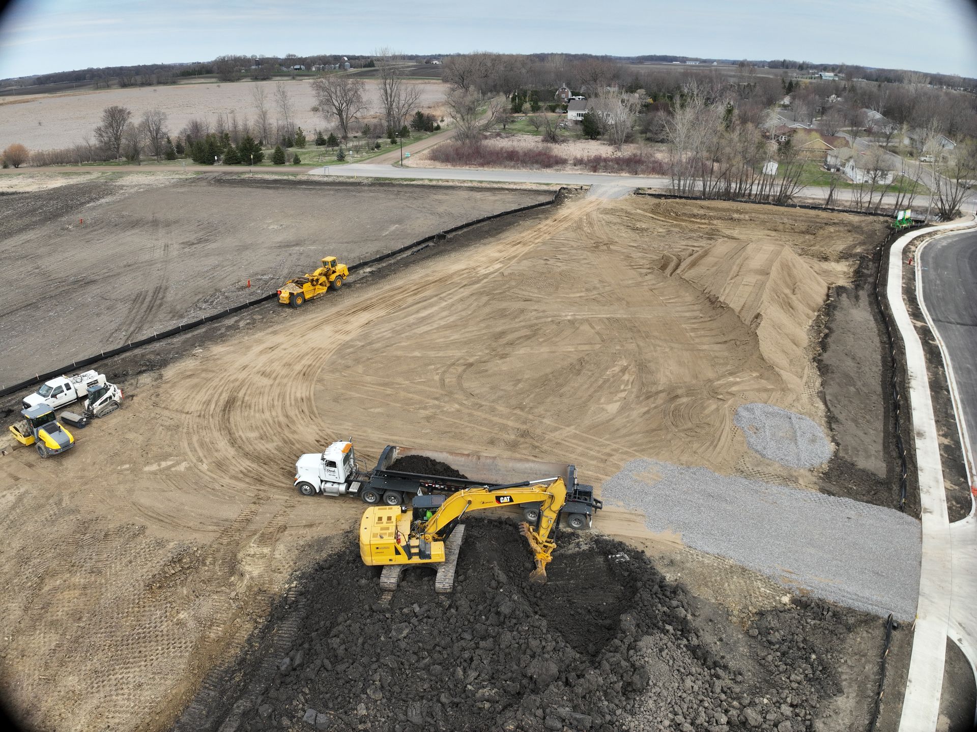 An aerial view of a construction site with a lot of machinery.