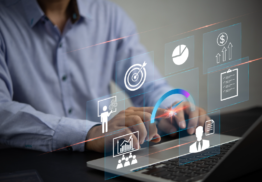 a man is typing on a laptop computer with a lot of icons coming out of it.