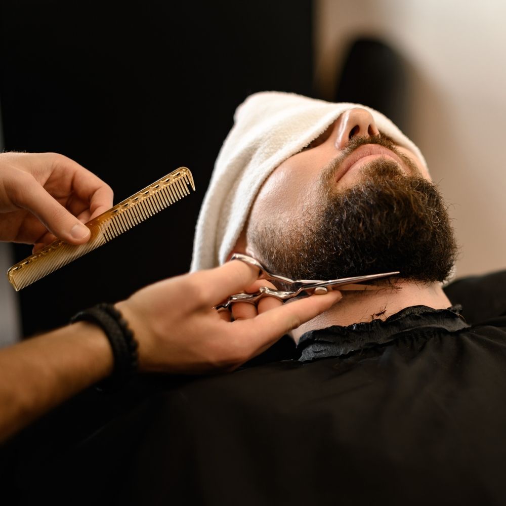 A Barber Trims a Man's Beard With Scissors and Comb — The Gentleman's Barber QLD in Toowoomba City, QLD