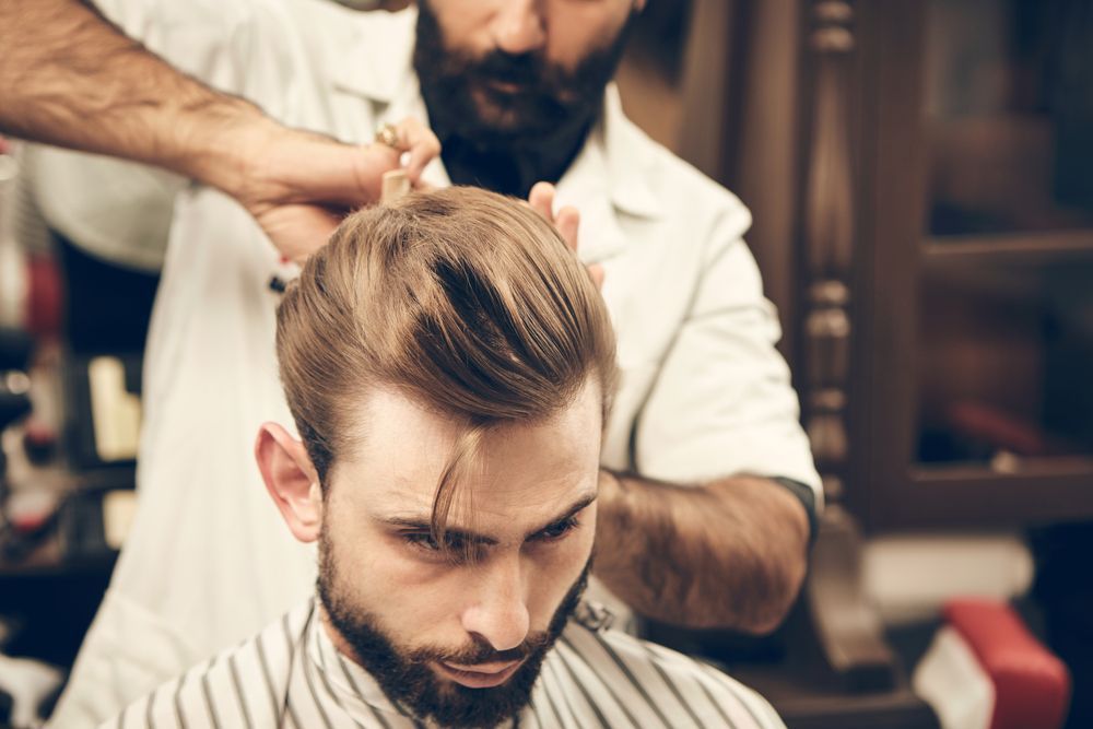 Barber Giving a Haircut to a Customer in a Barber Shop — The Gentleman's Barber QLD in Toowoomba City, QLD
