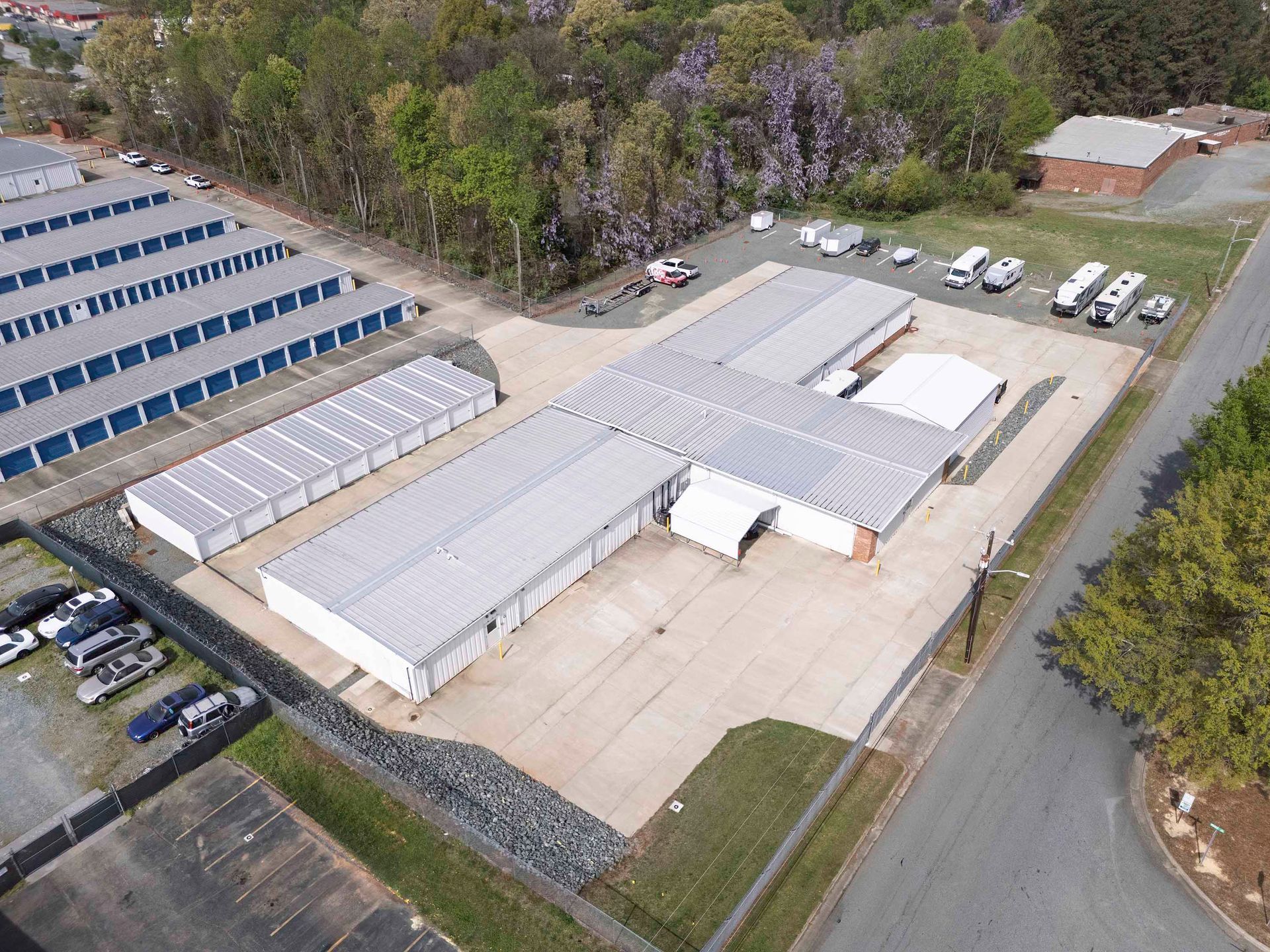 Aerial view of a self storage facility with parking and climate controlled storage units.