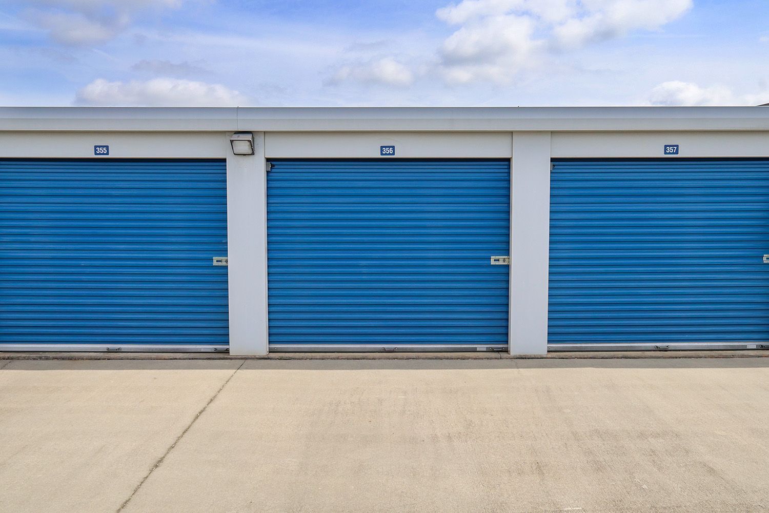 Drive up affordable self storage units with blue doors in Burlington, NC
