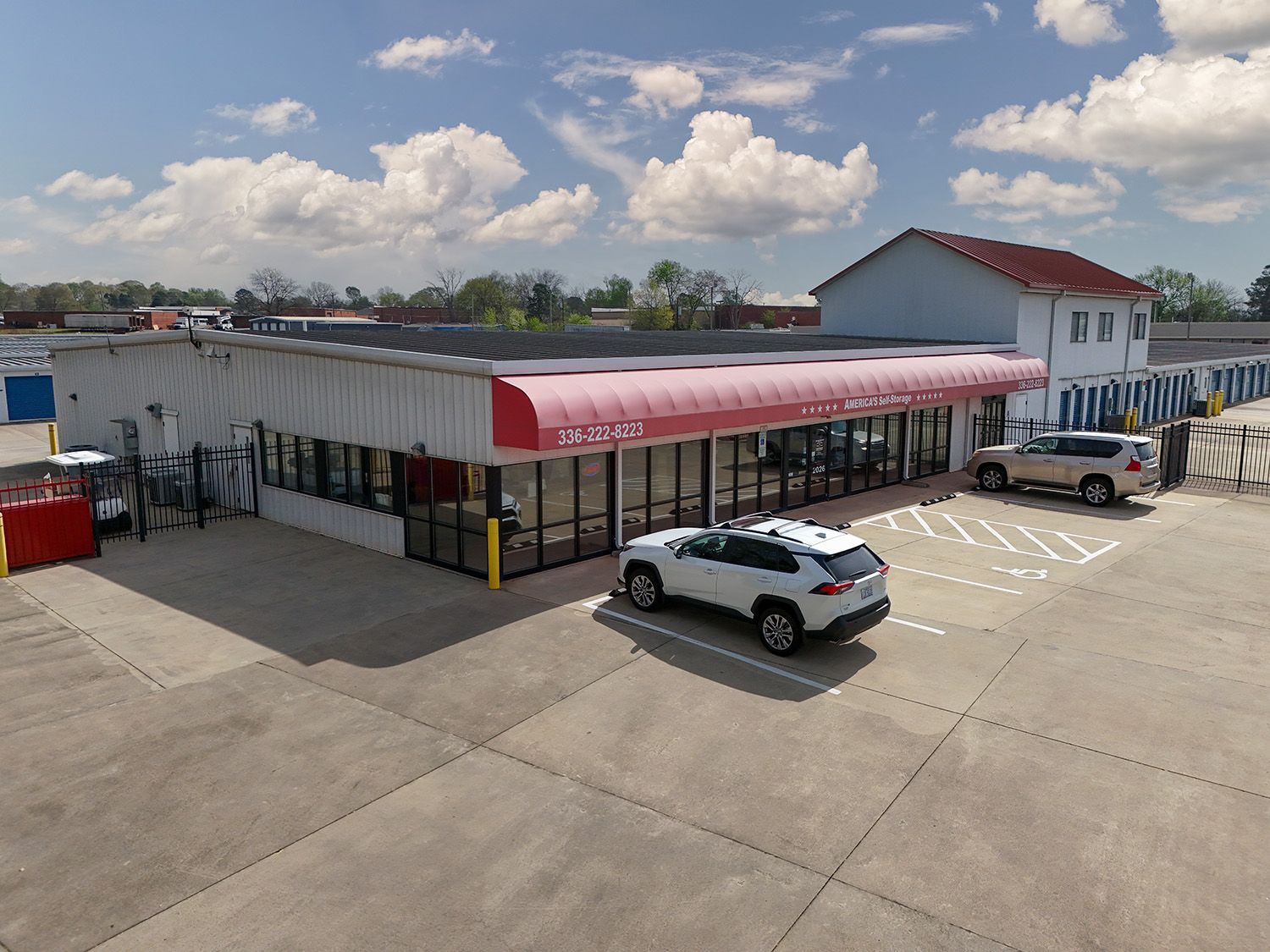 The main office for America's self-storage with a security gate and onsite parking visible in Burlington, NC.