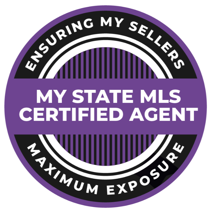 A dining room with a table and chairs and a wooden staircase.