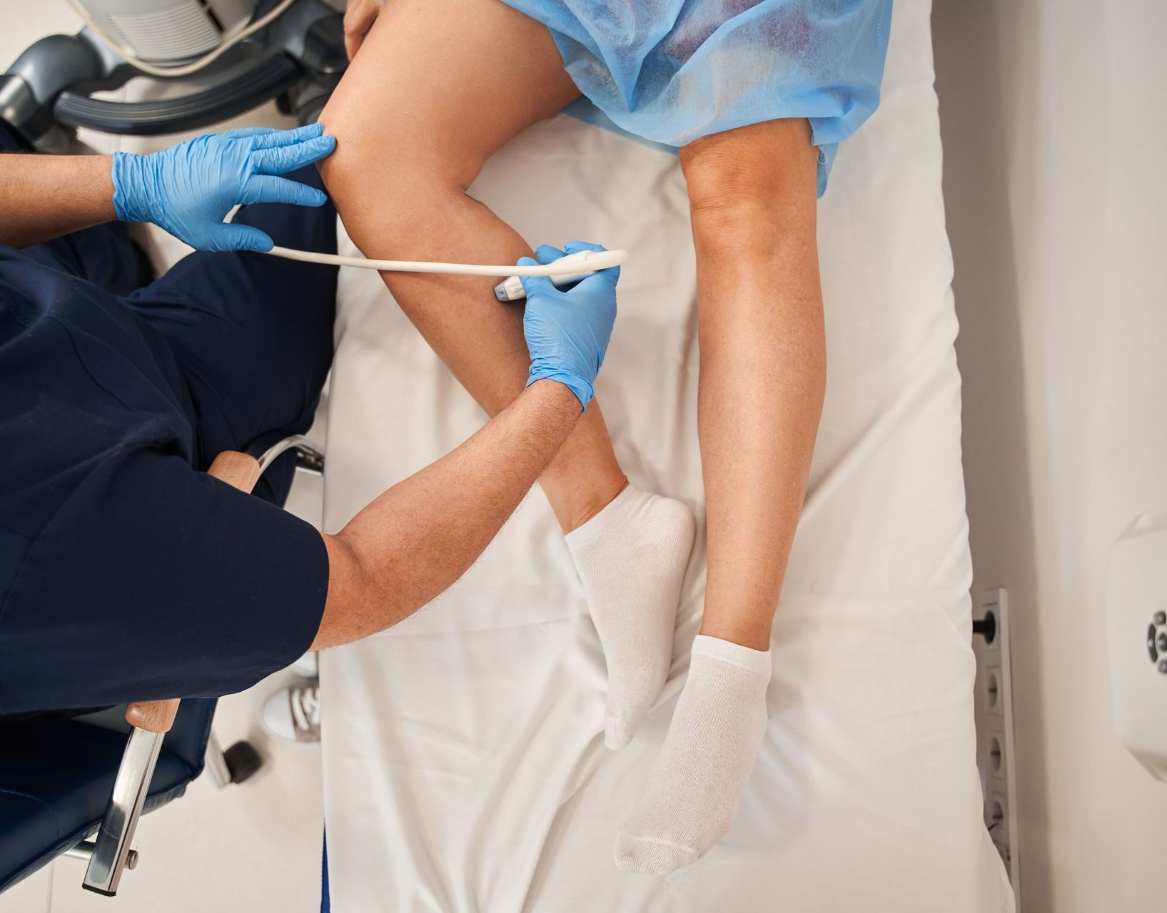 A woman is pointing at her eye with her finger.