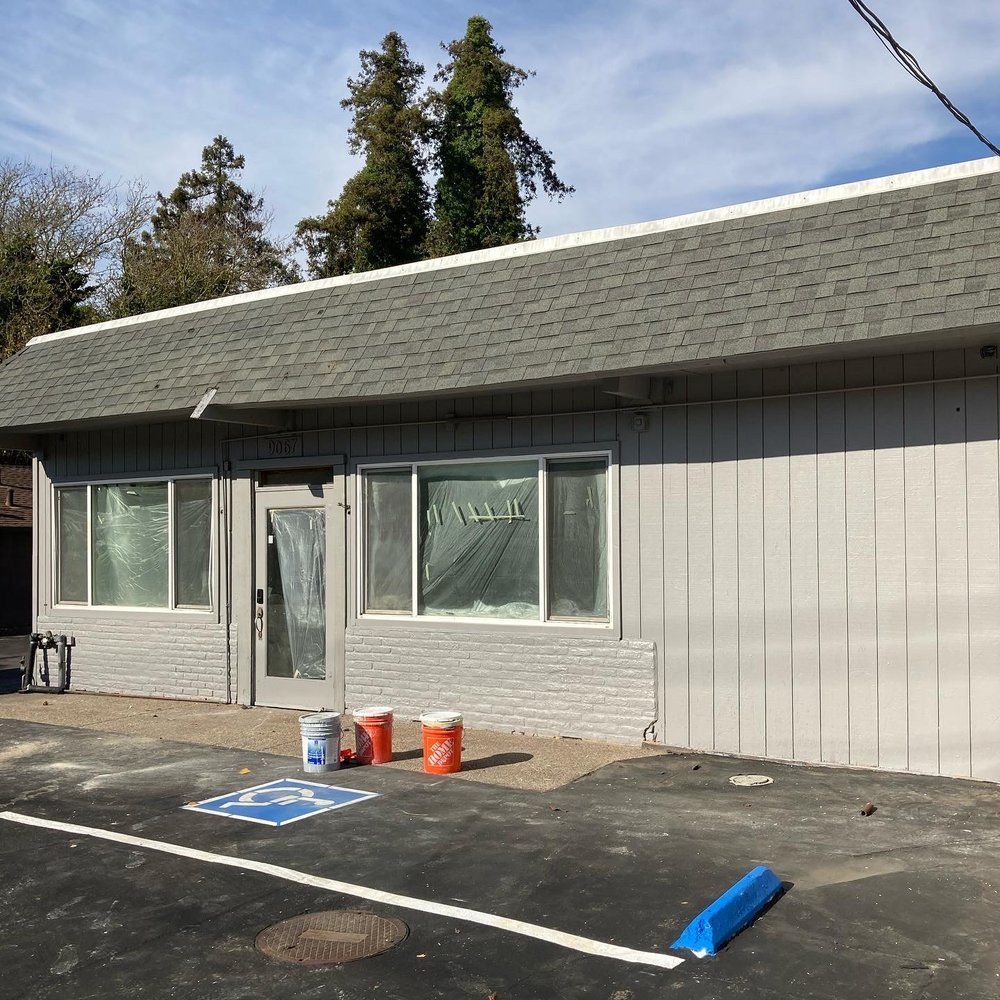 A building with a handicapped parking spot in front of it