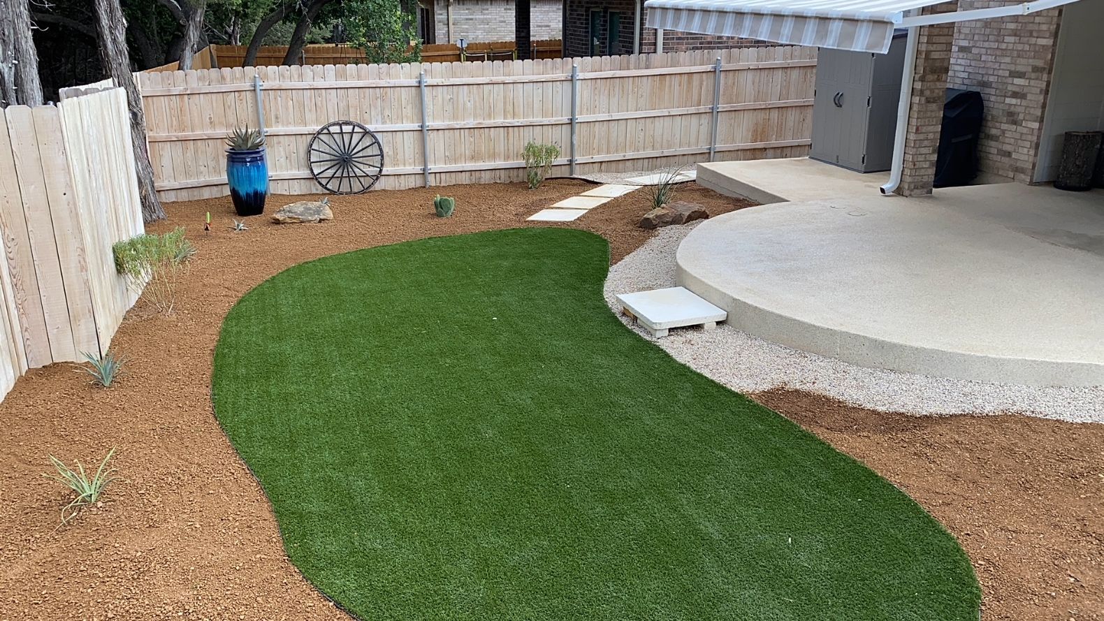 Xeriscape with artificial turf area
