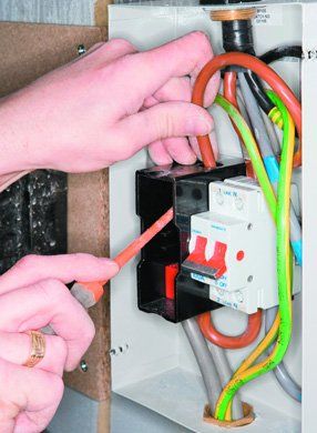 Electrical services - Palgrave, Norfolk - electrician working on an electrical fuse box - DAVID PEACHEY ELECTRICAL AND MECHANICAL