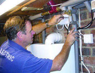 Electrical services - Palgrave, Norfolk - electrician working on central heating - DAVID PEACHEY ELECTRICAL AND MECHANICAL