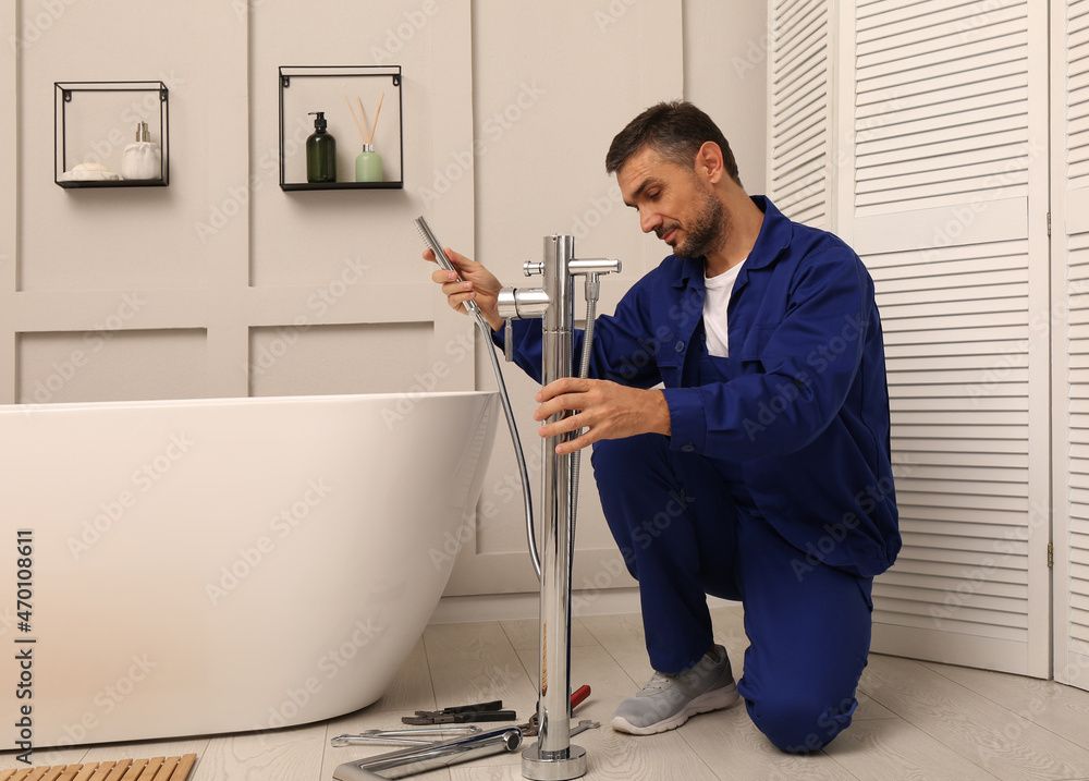 plumber installing a bathroom tap