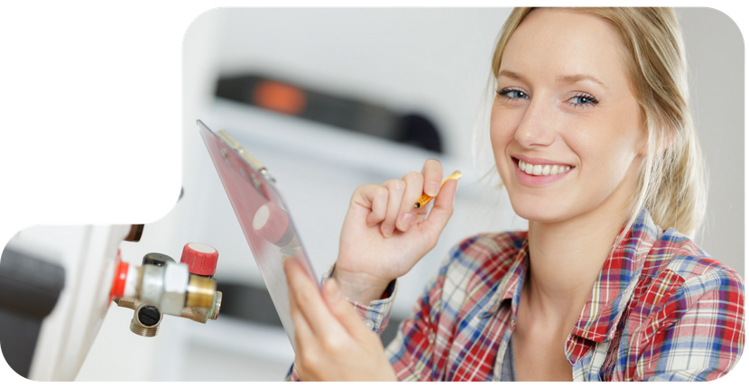 A woman is cleaning the filter of an air conditioner.