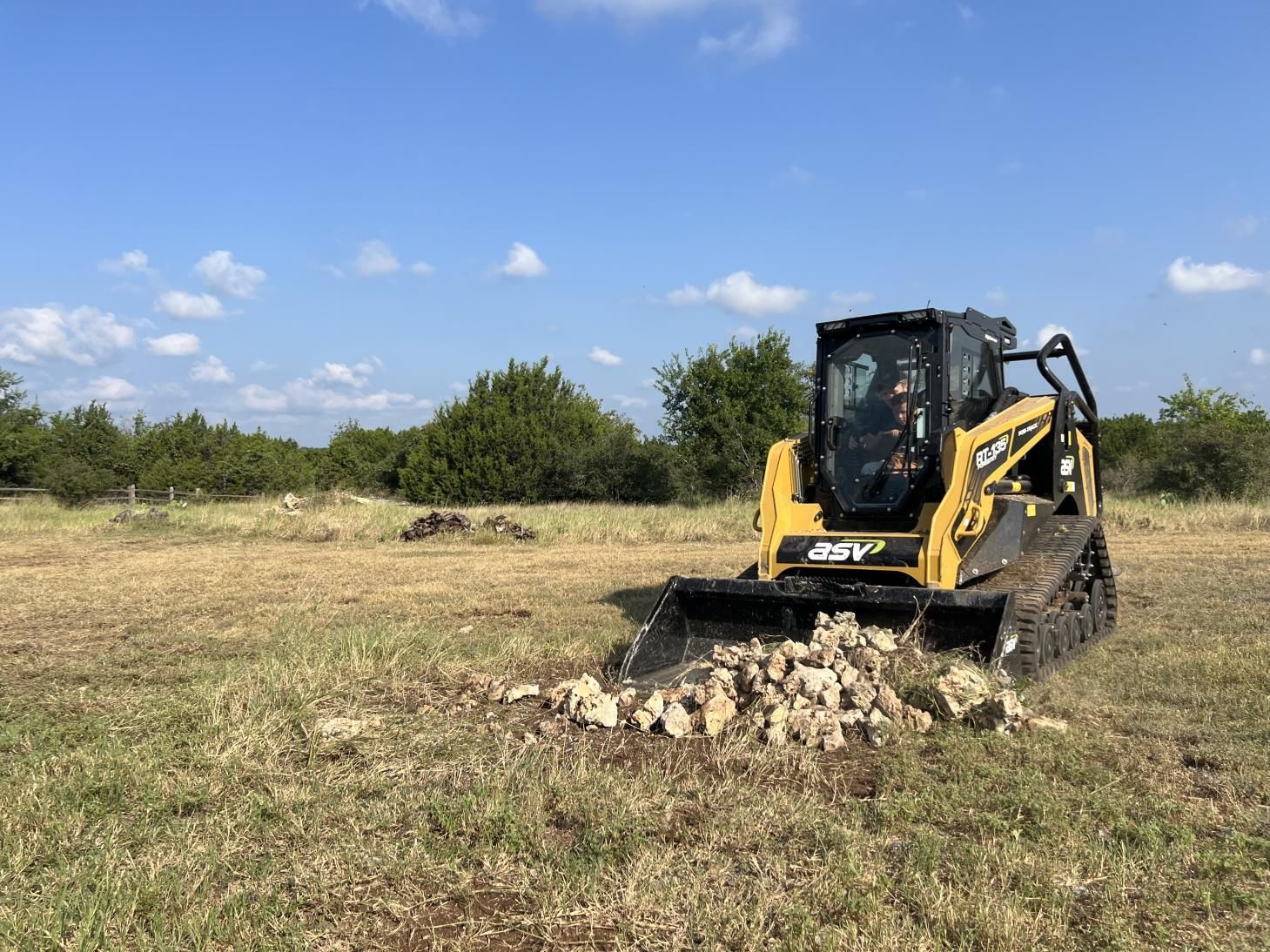 A bulldozer is moving dirt on a construction site