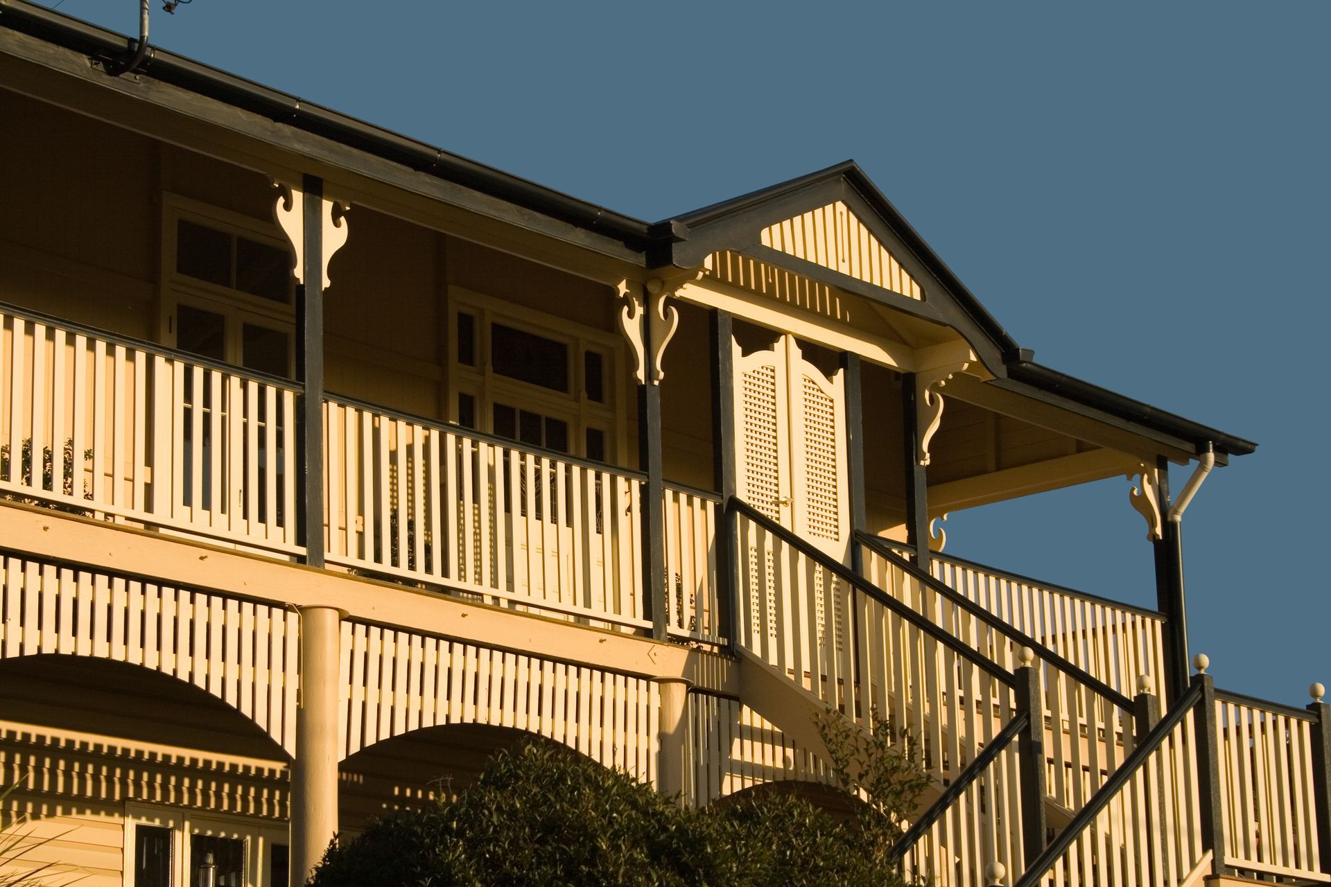 A large house with stairs leading up to the second floor