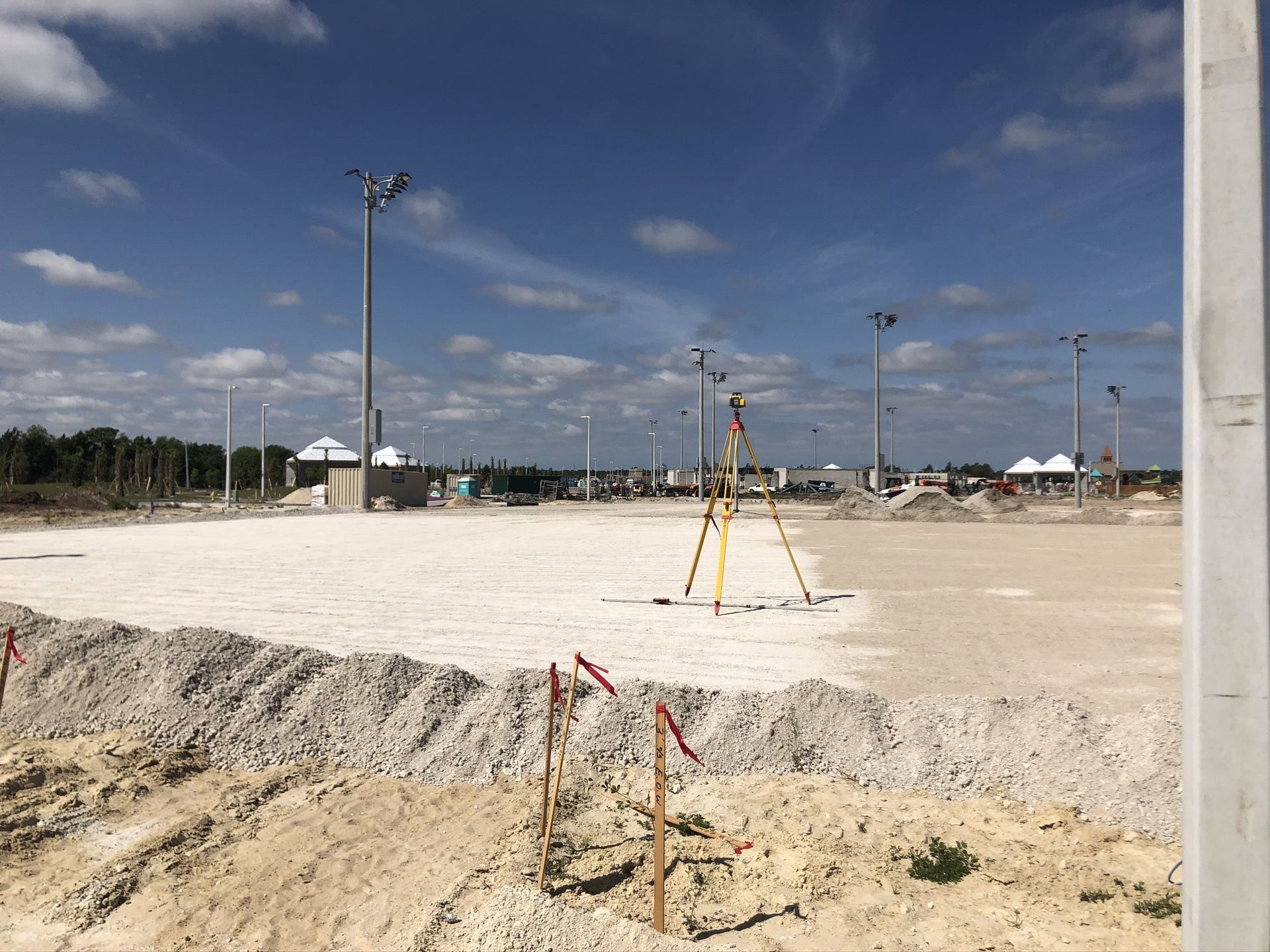 a construction site with a tripod in the middle of it