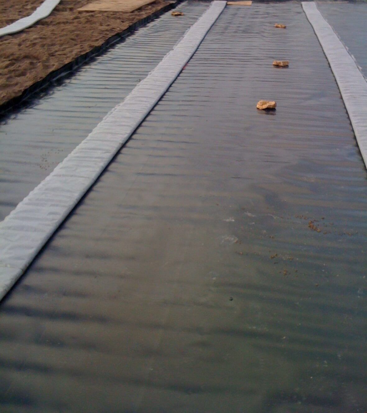 a row of white lines on a black surface