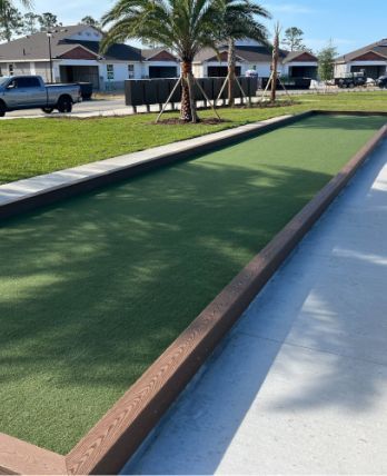 A bowling alley with a palm tree in the background