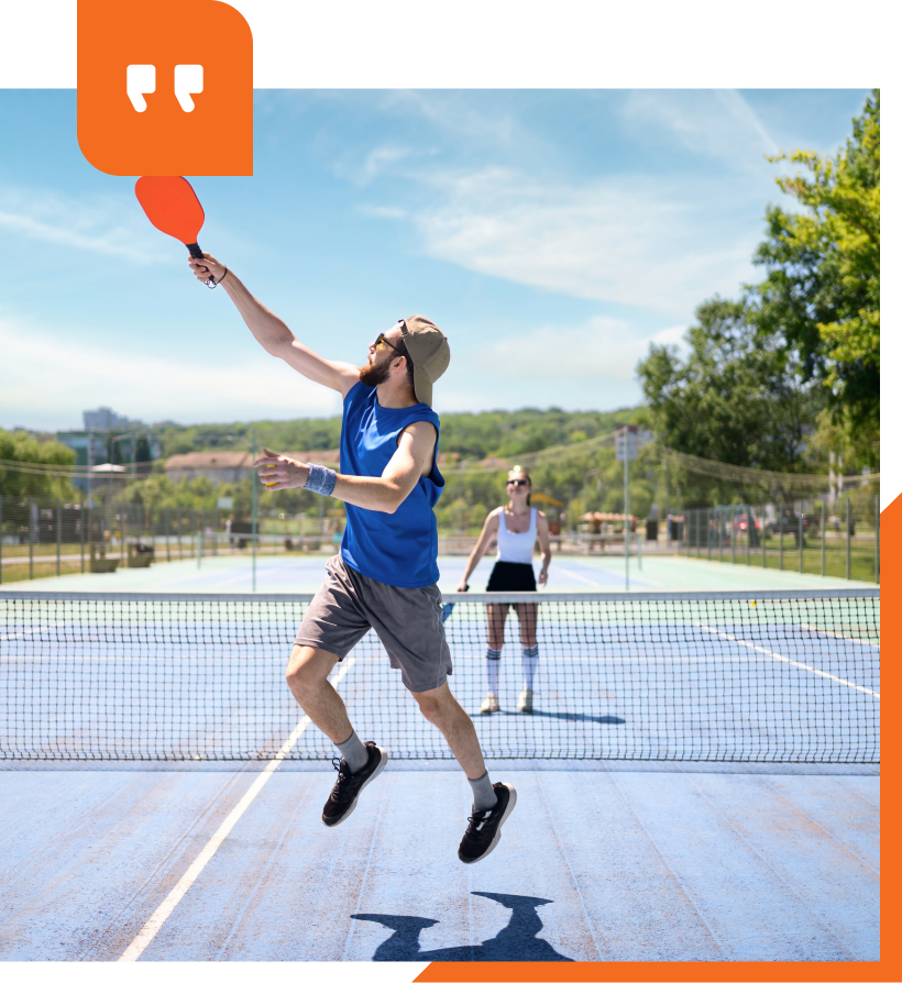 A tennis court in the middle of a forest