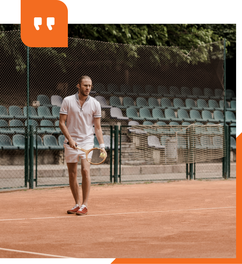 A tennis court in the middle of a forest