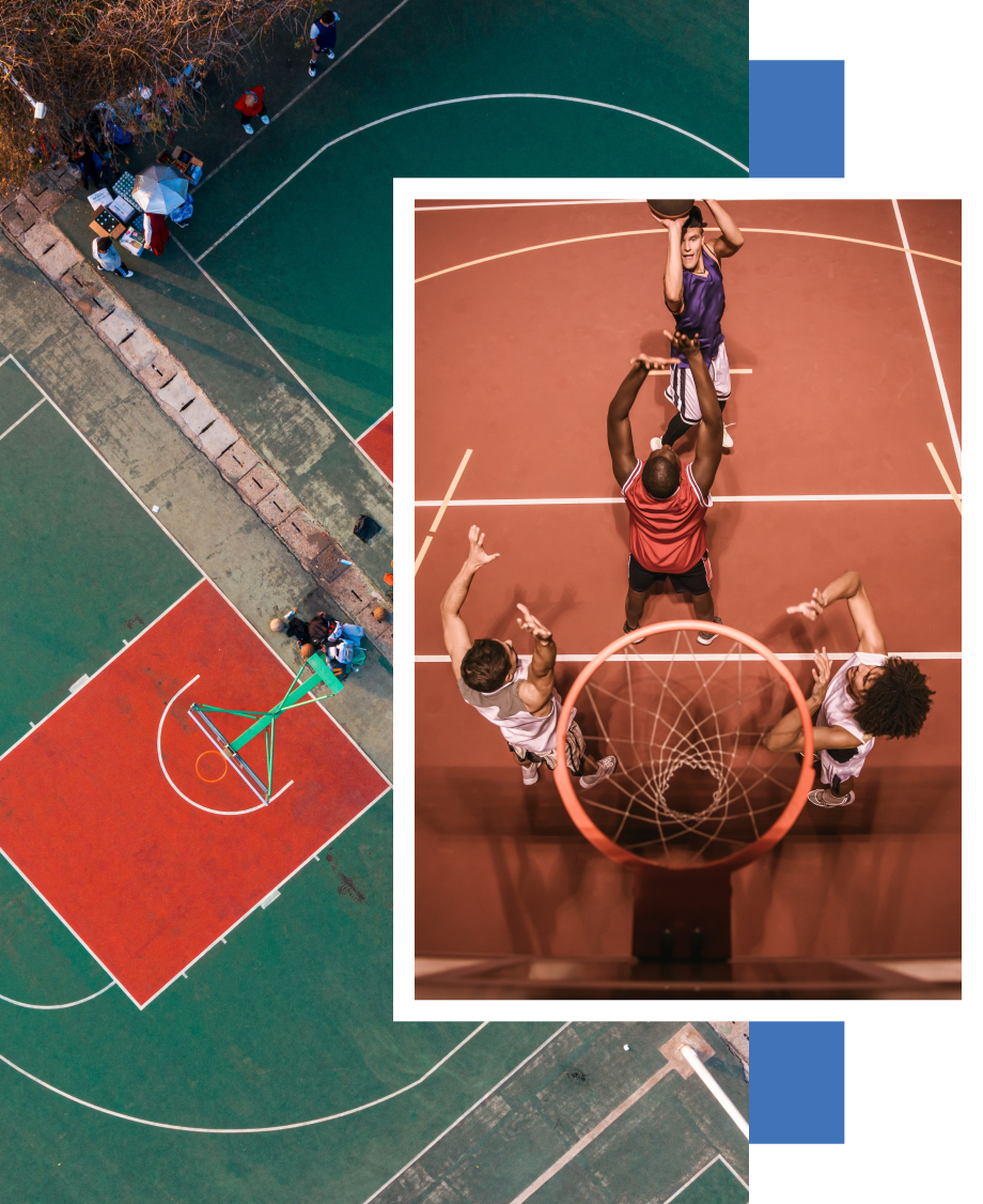 An aerial view of a basketball court with a basketball in the middle