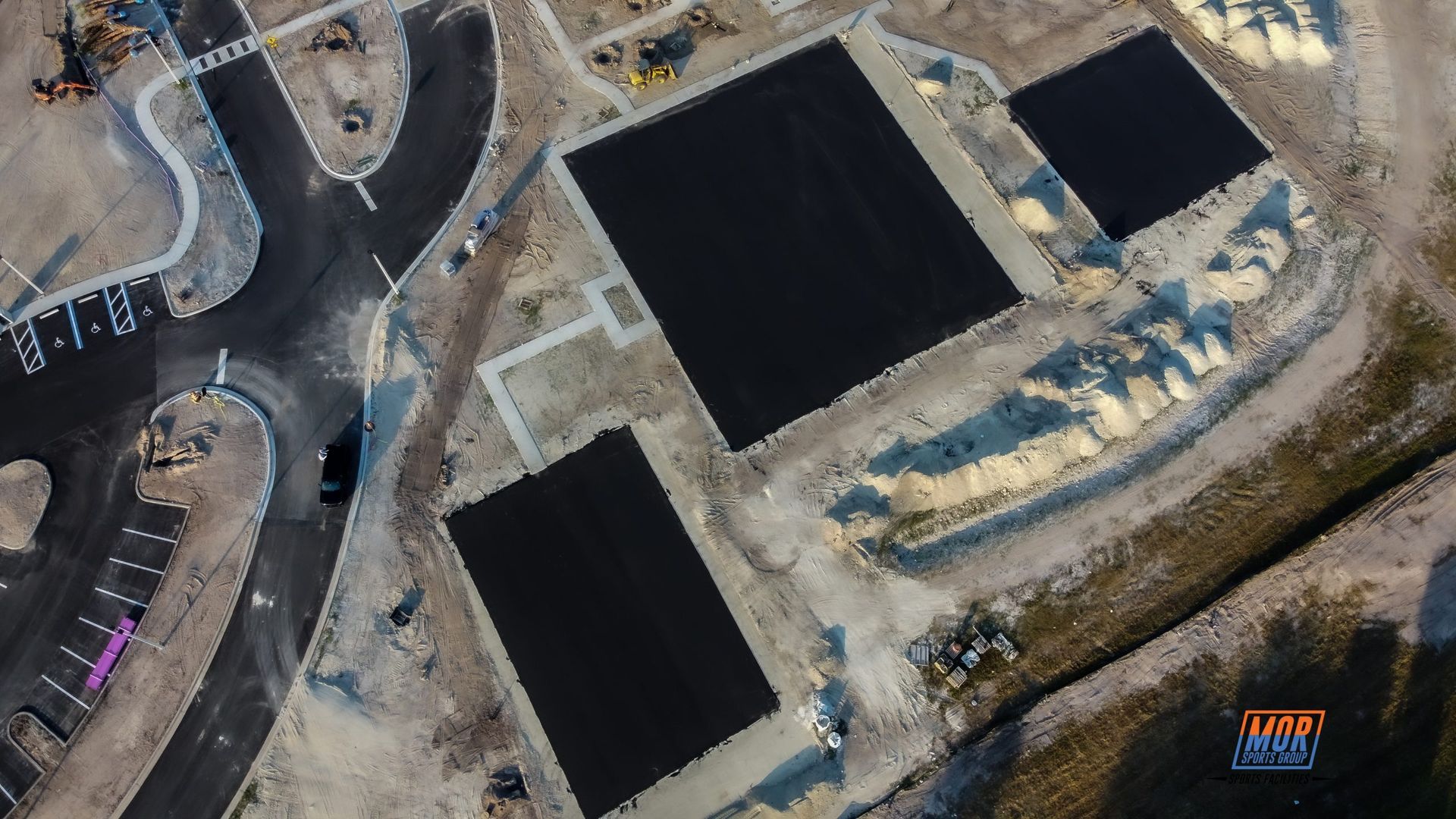 an aerial view of a construction site with a lot of black squares