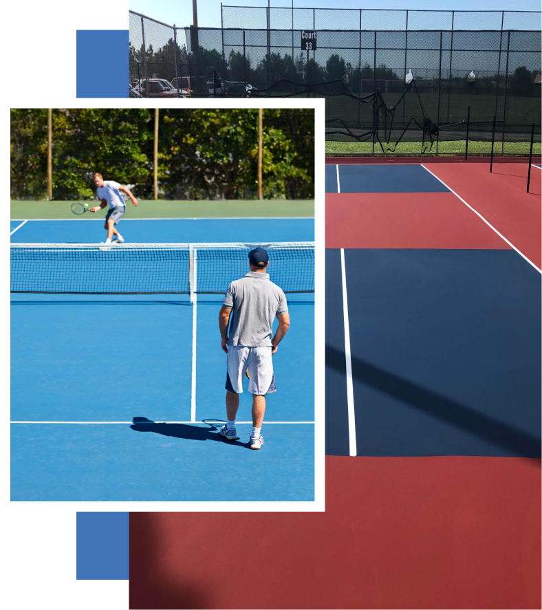 A man is playing tennis on a blue and red court