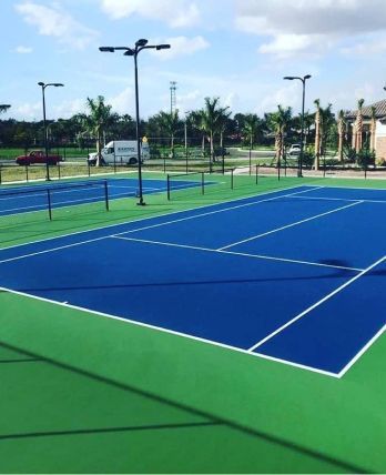 A tennis court with blue and green lines