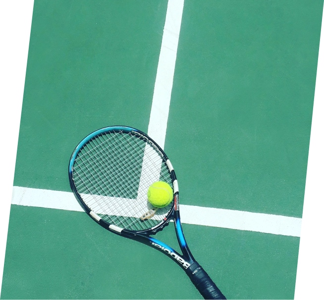 a tennis racket and ball on a tennis court