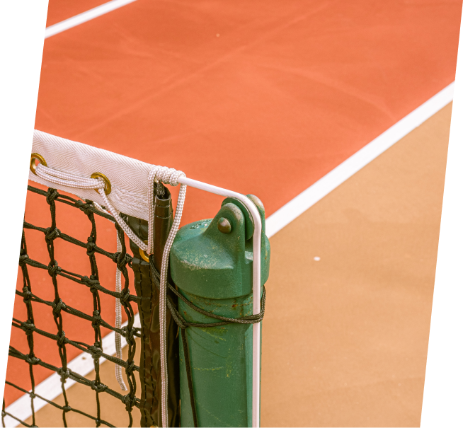 a tennis court with a green net and white lines