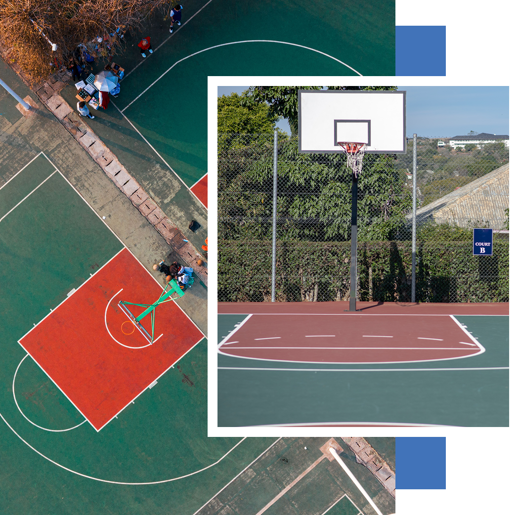 An aerial view of a basketball court and a basketball hoop