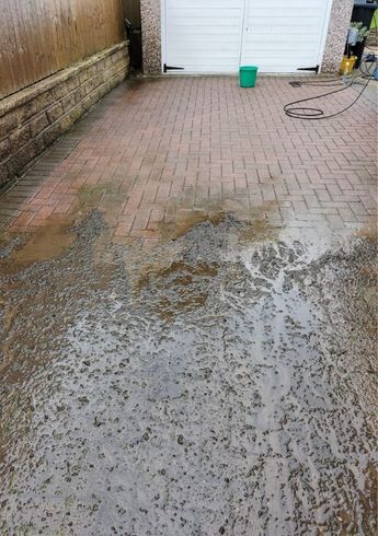 Jimmy's External Cleaning Services part way through block paving cleaning a driveway in Bradford