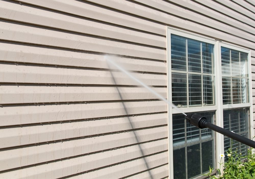 cladded wall being cleaned