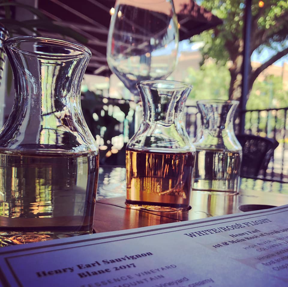 A bottle of henry earl sauvignon sits on a table