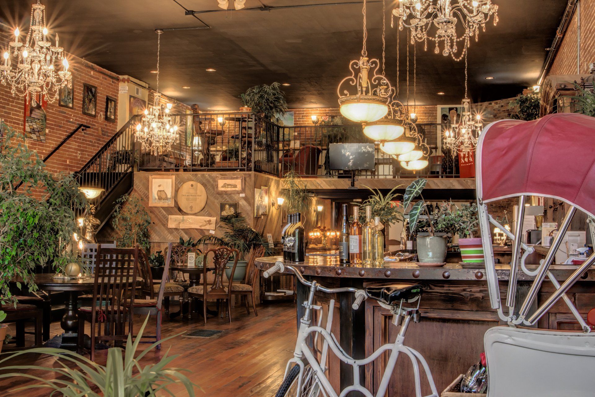 A restaurant with a bicycle in the middle of the room