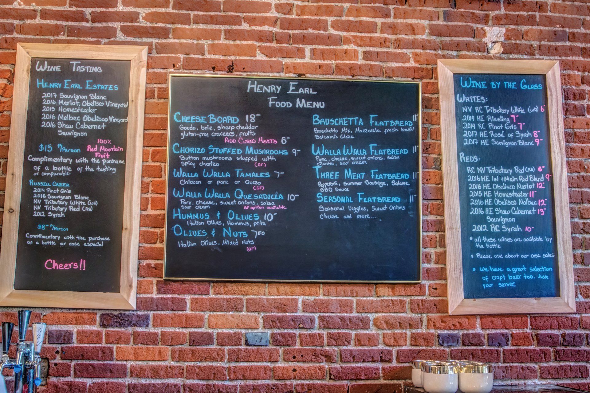 A brick wall with a menu written on it
