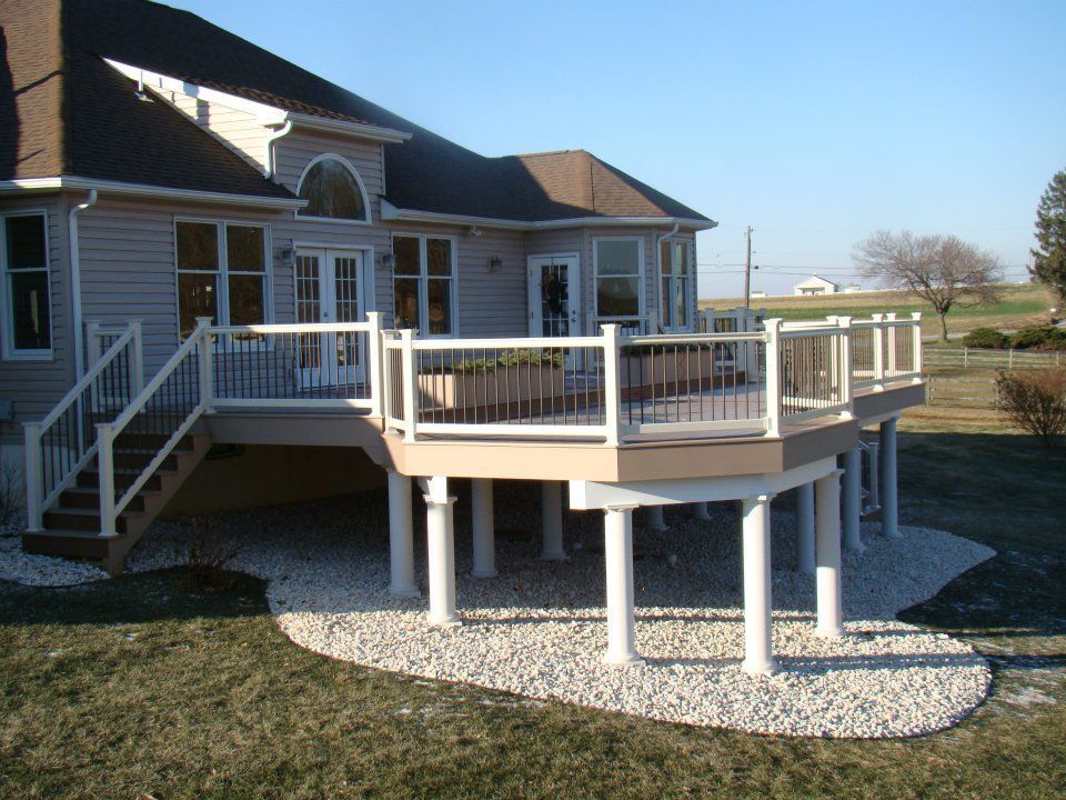 The back of a house with a deck and stairs
